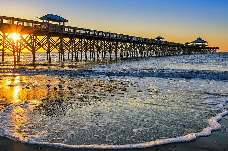 Jetée à Folly Beach au coucher de soleil