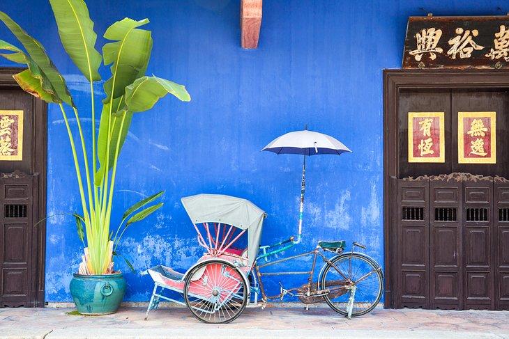 Rickshaw antiguo en la calle en Georgetown